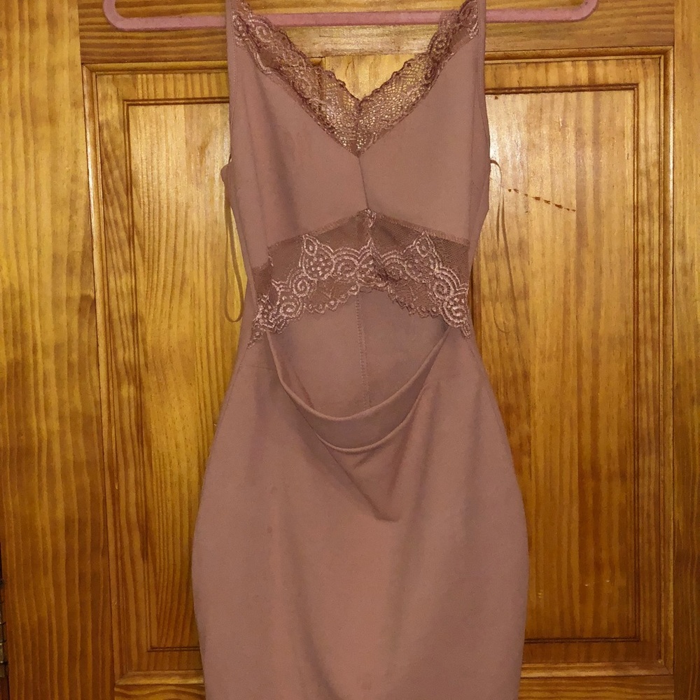 Light pink dress with lace detail and slit